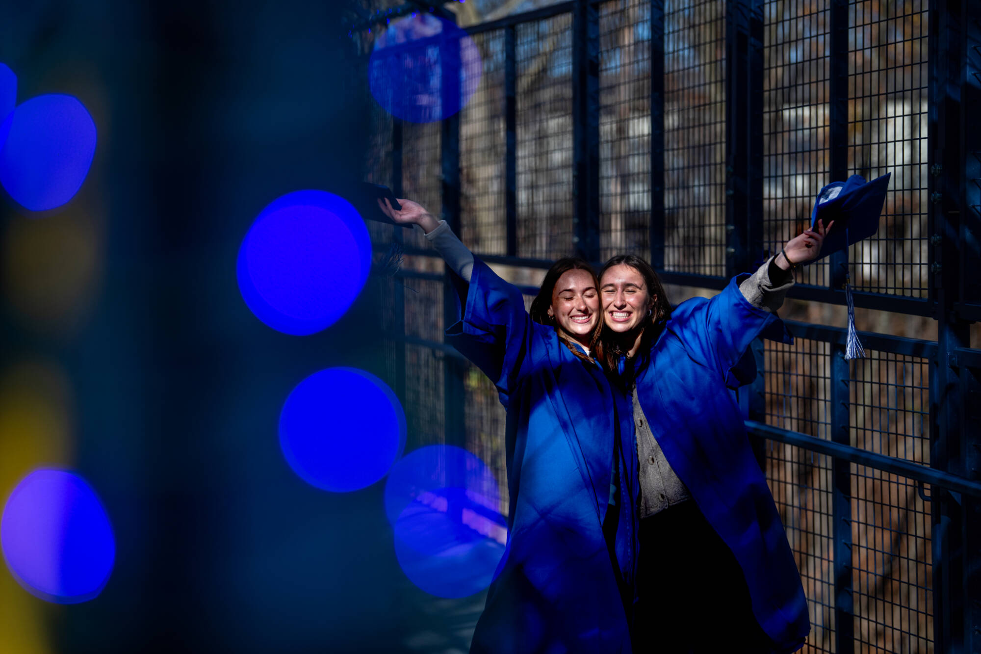 Students posing for a picture in their cap and gowns.